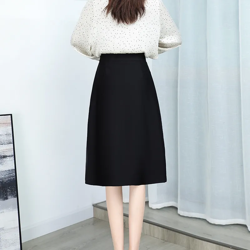 Reverse of the black A-line skirt showing the smooth waistband and rear shaping